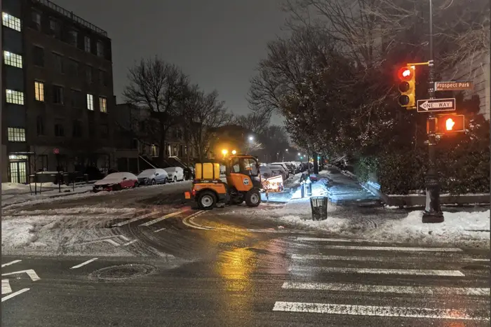 A photo of DSNY's mini-plow in action